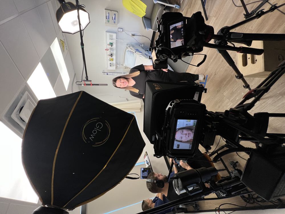 A two-camera podcast setup being filmed on location